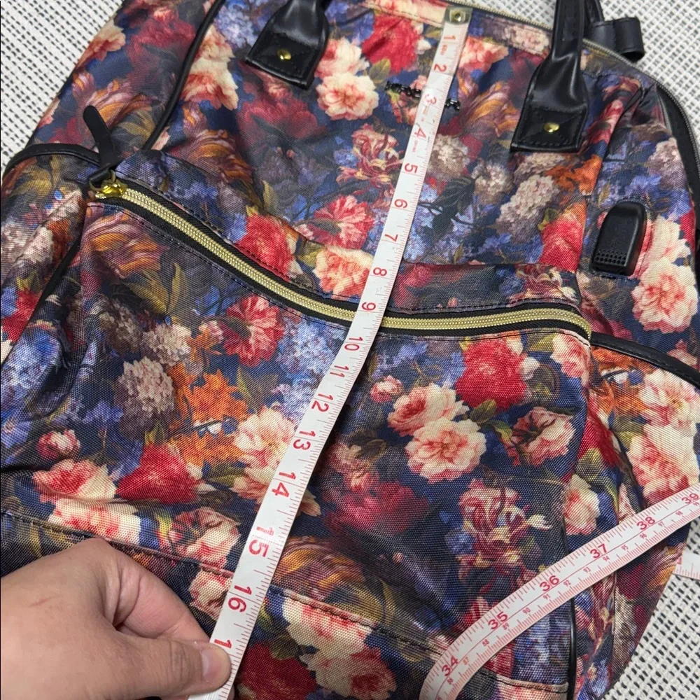 KROSER laptop backpack featuring a dark floral pattern